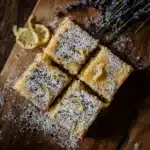 Lavender lemon bars on wooden table